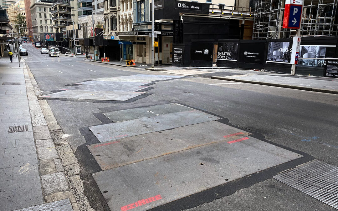 road plates covering a trench in a road under construction